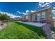 Private backyard with patio, grass, and mountain views at 1046 Rambling Oak Dr, Monument, CO 80132