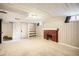 Finished basement features a fireplace, built-in shelving, and carpeted floors at 1460 Tennyson St, Denver, CO 80204