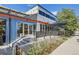 Modern restaurant with outdoor seating and a blue facade at 24786 E Evans Dr, Aurora, CO 80018