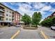 Community view showcasing tree-lined streets and buildings at 7865 Vallagio Ln # 207, Englewood, CO 80112