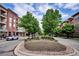 Community view with tree-lined streets and building at 7865 Vallagio Ln # 207, Englewood, CO 80112