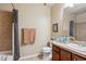 Bathroom with shower/tub combo, toilet, and vanity at 7865 Vallagio Ln # 207, Englewood, CO 80112