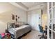 Small bedroom with daybed, workspace, and closet at 7865 Vallagio Ln # 207, Englewood, CO 80112