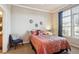 Comfortable bedroom with large window and neutral decor at 7865 Vallagio Ln # 207, Englewood, CO 80112