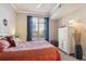 Bright bedroom with large window, dresser, and comfortable bedding at 7865 Vallagio Ln # 207, Englewood, CO 80112