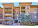 Attractive building exterior with landscaping at 7865 Vallagio Ln # 207, Englewood, CO 80112