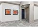 Building hallway with carpet and artwork at 7865 Vallagio Ln # 207, Englewood, CO 80112