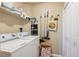 Laundry room with washer, dryer, and storage shelves at 7865 Vallagio Ln # 207, Englewood, CO 80112