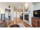 Living room offering hardwood floors and fireplace at 7865 Vallagio Ln # 207, Englewood, CO 80112