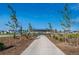 Community park with walking path and playground at 857 Sawdust Dr, Brighton, CO 80601