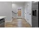 Light-filled hallway with hardwood floors and access to backyard at 2623 W 26Th Ave # 2, Denver, CO 80211