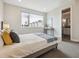 Bright bedroom with a comfortable bed and city view at 3354 W 18Th Ave, Denver, CO 80204