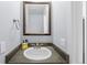 Small bathroom with sink and granite countertop at 14314 E Hawaii Cir # D, Aurora, CO 80012