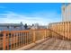 Private deck with wooden railings and neighborhood views at 14314 E Hawaii Cir # D, Aurora, CO 80012