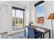 Home office with a desk, chair and large windows with city views at 3048 Stout St, Denver, CO 80205