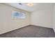 Spacious bedroom with neutral colored walls and carpeted flooring at 7902 Meade St # C10, Westminster, CO 80030