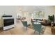 Bright living room with hardwood floors and modern furniture, featuring a dining area and comfy seating at 7902 Meade St # C10, Westminster, CO 80030