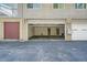 Attached single-car garage with open door at 7902 Meade St # C10, Westminster, CO 80030