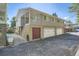 Building exterior showcasing multiple units with attached garages and a private entrance at 7902 Meade St # C10, Westminster, CO 80030