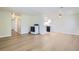 Open concept living space with hardwood flooring and a view into the kitchen at 7902 Meade St # C10, Westminster, CO 80030