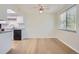 Simple dining area with hardwood floors and access to the kitchen at 7902 Meade St # C10, Westminster, CO 80030