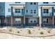 Modern townhome community with multiple units and balconies at 6940 Merseyside Ln, Castle Pines, CO 80108