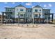 Modern townhome community with multiple units and balconies at 6940 Merseyside Ln, Castle Pines, CO 80108