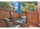 Private patio with table, chairs and umbrella at 12162 Bannock Cir # B, Denver, CO 80234