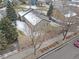 Aerial view of house showing backyard and part of neighborhood at 11353 Jersey Way, Thornton, CO 80233