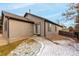 Tan exterior with sliding glass door and small yard at 11353 Jersey Way, Thornton, CO 80233