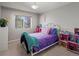 Bright bedroom with double bed and plenty of natural light at 11285 Deerfield Dr, Firestone, CO 80504