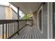 Private balcony with wooden decking and railings at 3462 S Eagle St # 201, Aurora, CO 80014