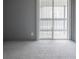 Bedroom with sliding door to deck and gray walls at 3462 S Eagle St # 201, Aurora, CO 80014