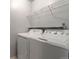 Laundry room with washer and dryer, and overhead shelving at 3462 S Eagle St # 201, Aurora, CO 80014
