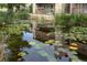 Landscaped pond with lily pads and a duck at 3462 S Eagle St # 201, Aurora, CO 80014