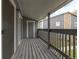 Private balcony with wooden decking and railings at 3462 S Eagle St # 201, Aurora, CO 80014