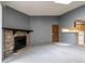 Living room with fireplace and view into kitchen area at 3462 S Eagle St # 201, Aurora, CO 80014