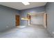 Open living room with kitchen, dining and access to balcony at 3462 S Eagle St # 201, Aurora, CO 80014
