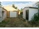 View of detached garage and shed in backyard at 7261 Magnolia St, Commerce City, CO 80022
