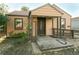 A beige ranch house with a covered porch and ramp at 7261 Magnolia St, Commerce City, CO 80022