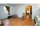 Living room with hardwood floors and an archway leading to the dining area at 7261 Magnolia St, Commerce City, CO 80022
