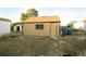 Detached single car garage with a small window at 7261 Magnolia St, Commerce City, CO 80022