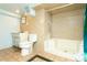 Small basement bathroom with shower and tile flooring at 7261 Magnolia St, Commerce City, CO 80022