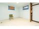 Unfinished basement with tile floor and small window at 7261 Magnolia St, Commerce City, CO 80022
