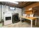 Basement laundry area with washer, dryer, and work table at 7261 Magnolia St, Commerce City, CO 80022
