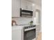 Modern kitchen with built-in microwave and gas range at 1553 Cherry St, Denver, CO 80220