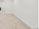 Unfinished basement area with carpeted floors at 1553 Cherry St, Denver, CO 80220