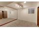 Finished basement room with mirrored wall and carpet at 9195 W 89Th Ct, Westminster, CO 80021