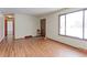 Living room with hardwood floors and view to hallway and kitchen at 9195 W 89Th Ct, Westminster, CO 80021