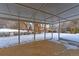 Covered patio overlooking a snow-covered backyard at 9195 W 89Th Ct, Westminster, CO 80021